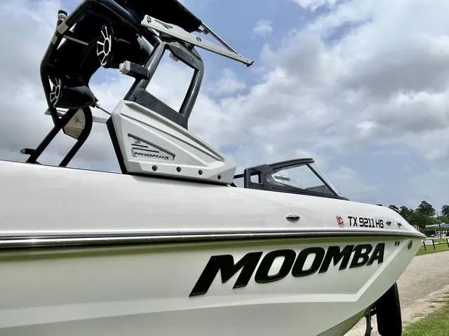 Slide: The Image of 2019 Moomba Makai™ boat with wakeboard tower, side view under cloudy sky. - 8