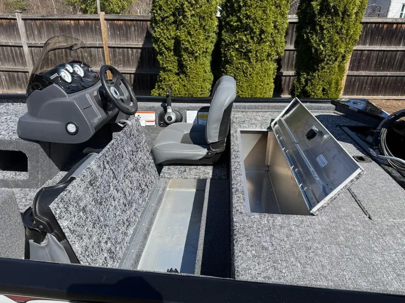 Slide: The Image of 2025 Tracker Pro Team 175 boat interior with seating and storage compartments. - 10