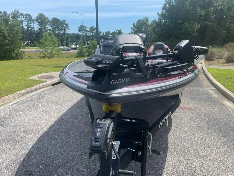Slide: The Image of 2025 Nitro Z18 Pro boat with Garmin equipment on a sunny day. - 1