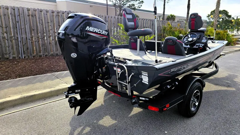 Slide: The Image of 2025 Ranger RT178 boat with Mercury outboard motor, parked on a trailer. - 2