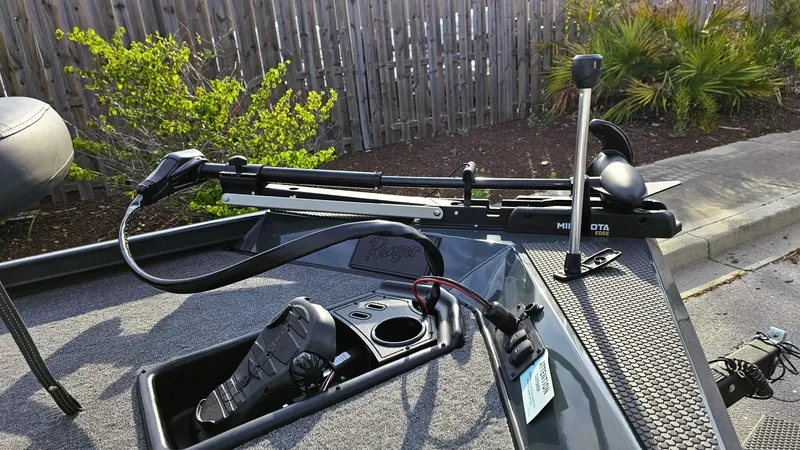 Slide: The Image of 2025 Ranger RT178 boat deck with trolling motor and control panel. - 6