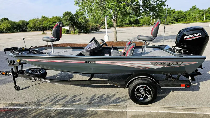 Slide: The Image of 2025 Ranger RT178 fishing boat with Mercury engine, parked outdoors on a trailer. - 8