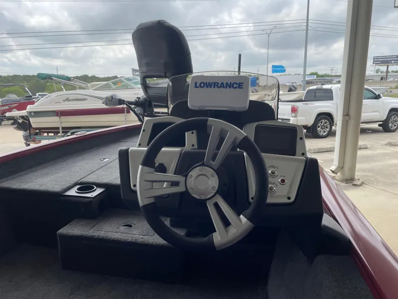 Slide: The Image of 2025 Tracker Pro Team 175 boat dashboard with Lowrance electronics, steering wheel, and controls. - 10