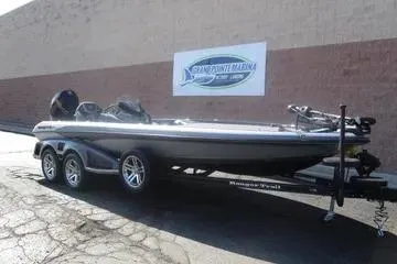 Slide: The Image of 2024 Ranger Z521R Ranger Cup Equipped boat on trailer, parked outside showroom. - 33