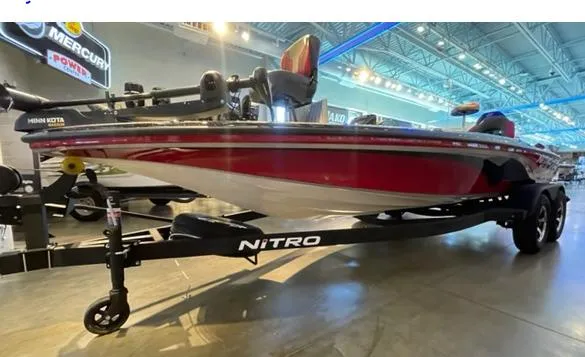 Slide: The Image of 2025 Nitro Z19 boat on display in a showroom, featuring a sleek red design. - 2