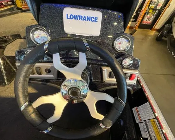 Slide: The Image of Steering wheel and dashboard of 2025 Nitro Z19 boat with Lowrance display. - 6