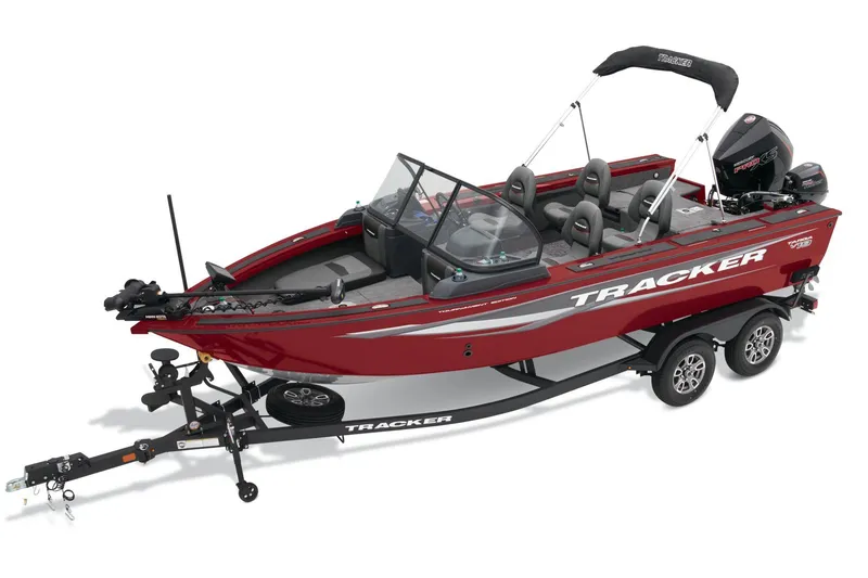 Slide: The Image of 2025 Tracker Targa V-19 Combo boat on trailer, red exterior, parked outdoors. - 2