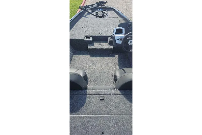 Slide: The Image of 2025 Tracker Pro Team 175 boat interior with steering wheel and seating. - 62