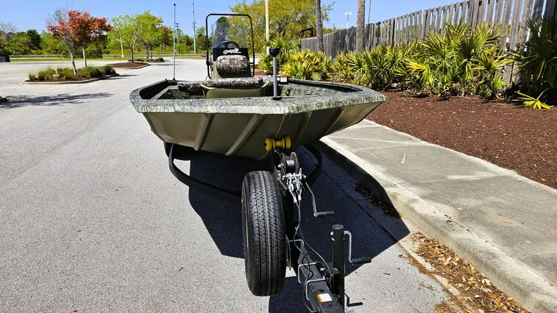 Slide: The Image of 2025 Tracker Grizzly 1860 CC boat on trailer in parking lot. - 6