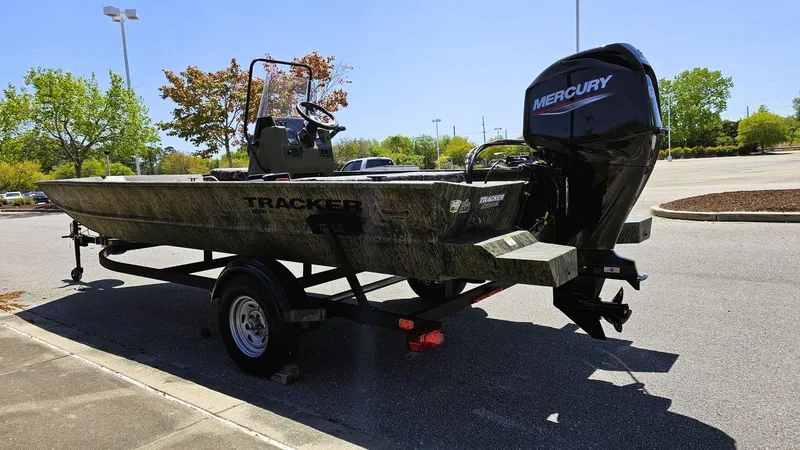 Slide: The Image of 2025 Tracker Grizzly 1860 CC boat with Mercury engine on trailer in parking lot. - 7
