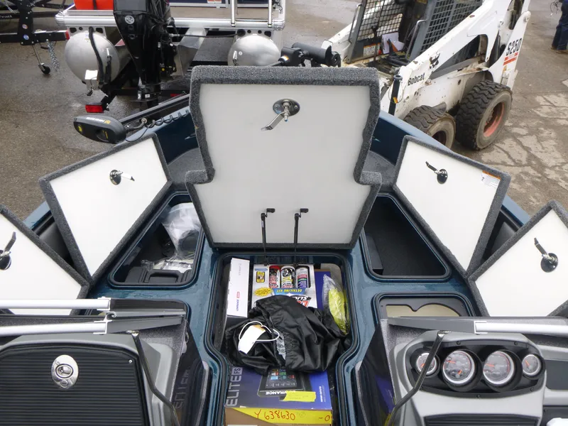 Slide: The Image of 2024 Ranger 1880MS boat storage compartments open, showcasing organized gear and equipment. - 13