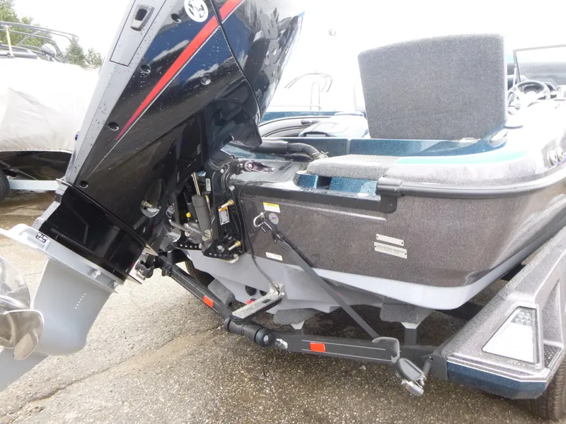 Slide: The Image of 2024 Ranger 1880MS boat with powerful outboard motor, sleek design, and durable construction. - 5