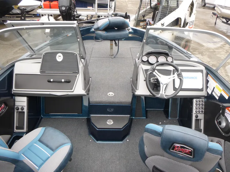 Slide: The Image of 2024 Ranger 1880MS boat interior with modern dashboard and seating. - 9