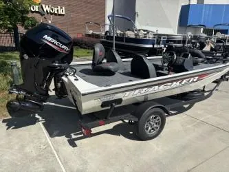 Slide: The Image of 2025 Tracker Pro Team 175 boat with Mercury engine on a trailer. - 2