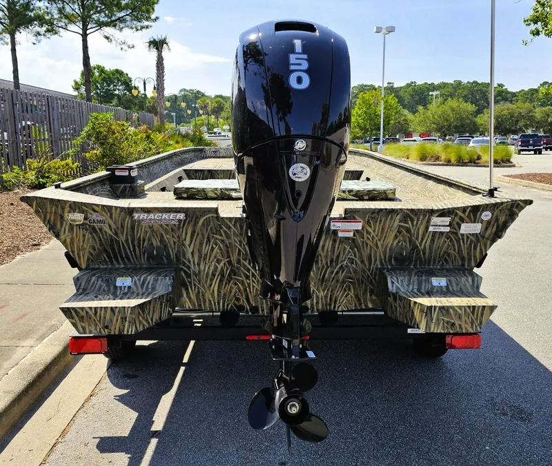 Slide: The Image of 2025 Tracker Grizzly 2072 CC boat with camo design and 150 HP outboard motor. - 3