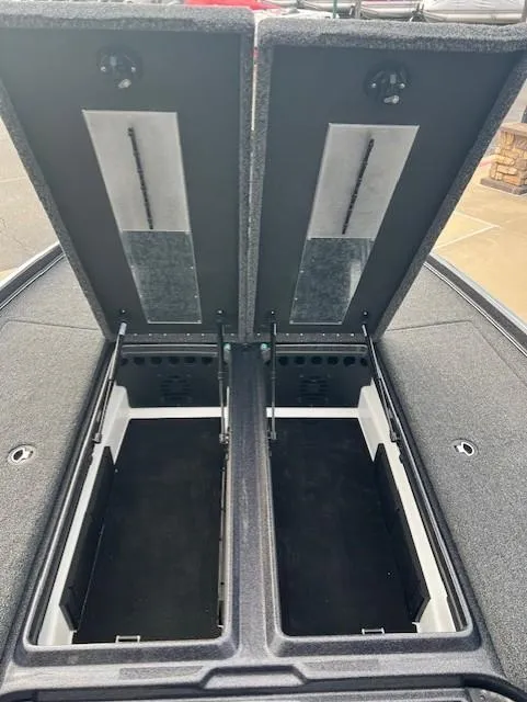 Slide: The Image of 2025 Nitro Z21 XL Pro boat storage compartments open, showcasing spacious interior design. - 11