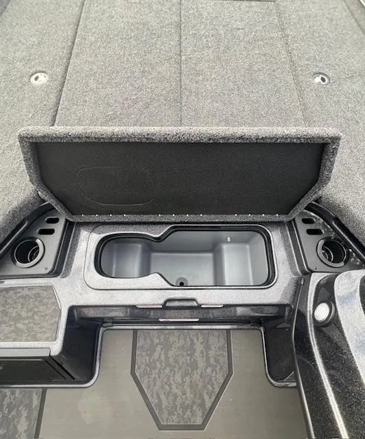 Slide: The Image of 2025 Nitro Z21 XL Pro boat storage compartment with cup holders and sleek design. - 15