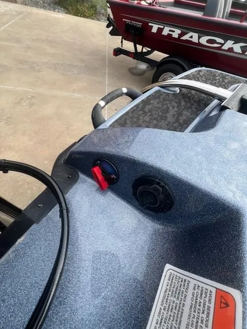 Slide: The Image of 2025 Nitro Z21 XL Pro boat dashboard with controls and warning label. - 18