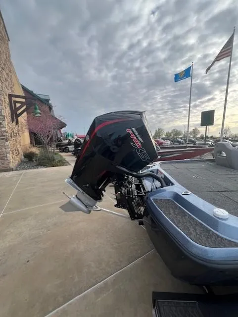 Slide: The Image of 2025 Nitro Z21 XL Pro boat with powerful outboard motor, parked outdoors under cloudy sky. - 4