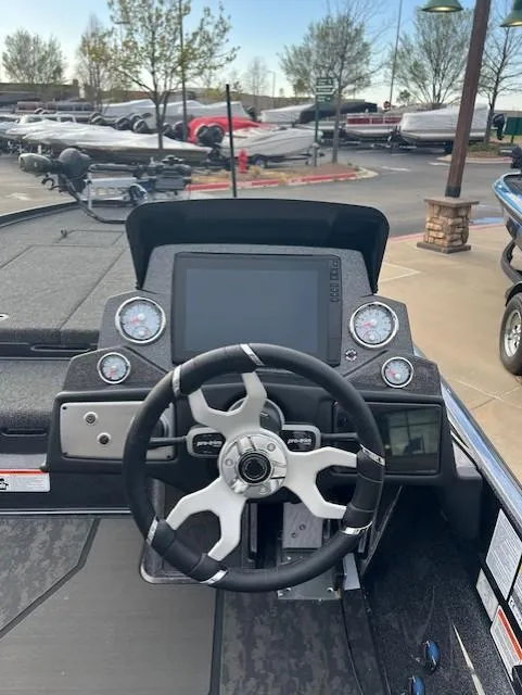 Slide: The Image of 2025 Nitro Z21 XL Pro boat dashboard with steering wheel and digital display. - 9