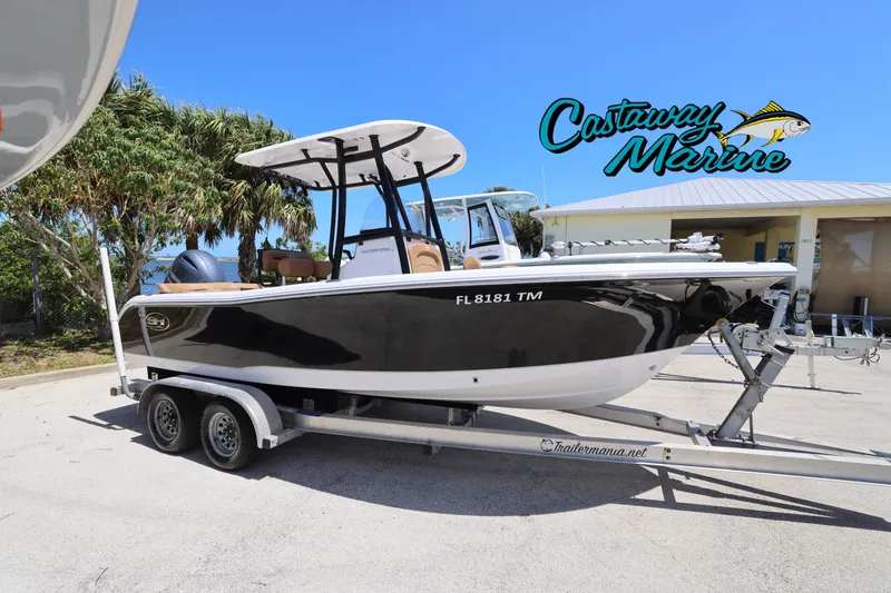 Slide: The Image of 2023 Sea Hunt Ultra 219 boat on trailer at Castaway Marine dealership. - 0