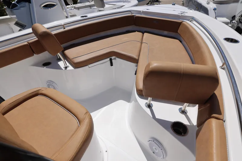 Slide: The Image of 2023 Sea Hunt Ultra 219 boat interior with tan seating and modern design. - 1