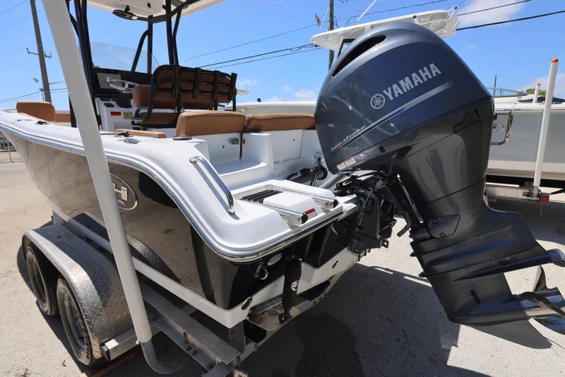 Slide: The Image of 2023 Sea Hunt Ultra 219 boat with Yamaha outboard motor on trailer. - 8