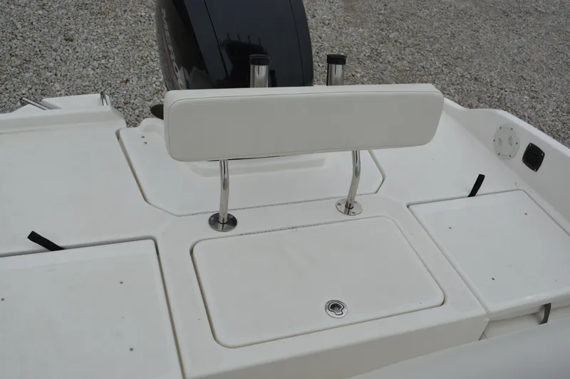 Slide: The Image of 2021 Bayliner Element F21 boat deck with seating and storage compartments. - 13