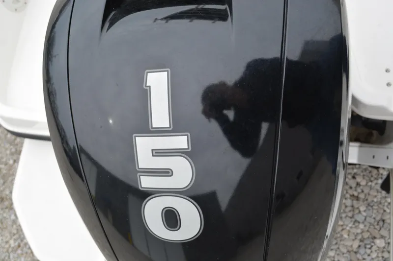 Slide: The Image of Close-up of 150 HP outboard motor on 2021 Bayliner Element F21 boat. - 16