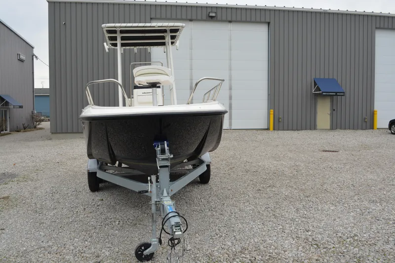 Slide: The Image of 2021 Bayliner Element F21 boat on trailer in industrial lot. - 3