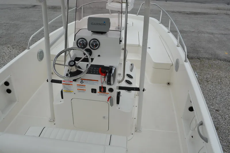 Slide: The Image of 2021 Bayliner Element F21 boat interior with steering console and Garmin navigation system. - 8