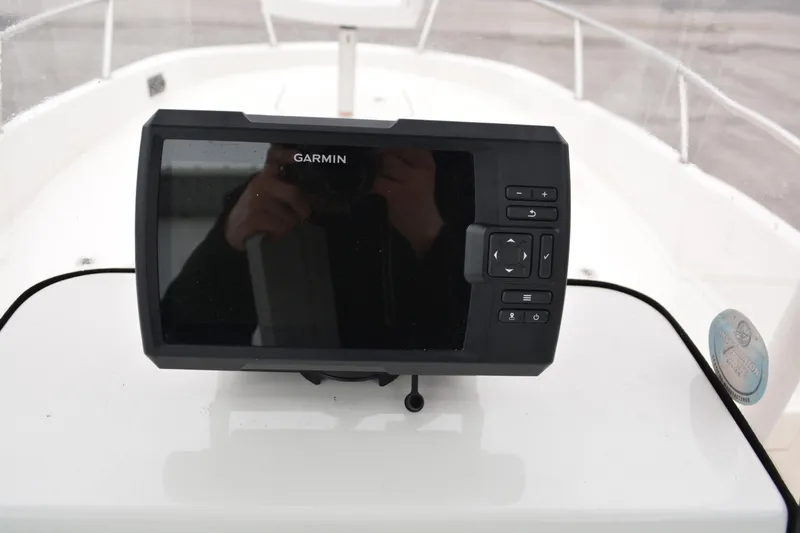 Slide: The Image of Garmin navigation system on 2021 Bayliner Element F21 boat dashboard. - 9