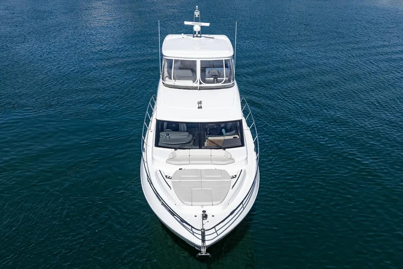 Slide: The Image of Luxury 2022 Princess F55 yacht on calm blue water, aerial view. - 14