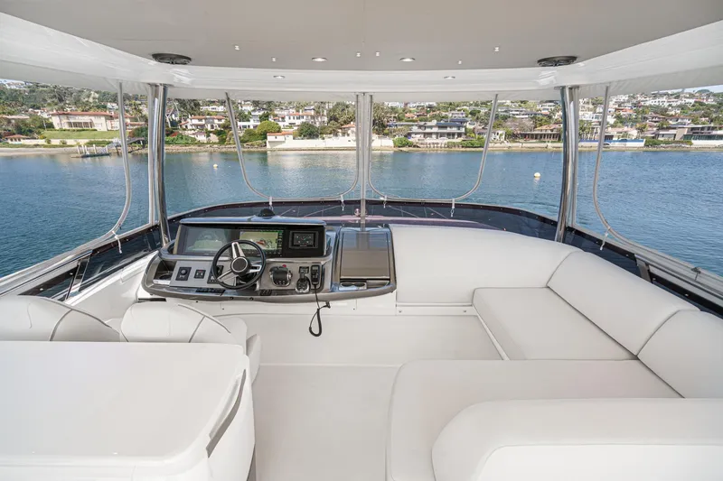 Slide: The Image of Luxurious 2022 Princess F55 yacht interior with modern helm and panoramic water views. - 19
