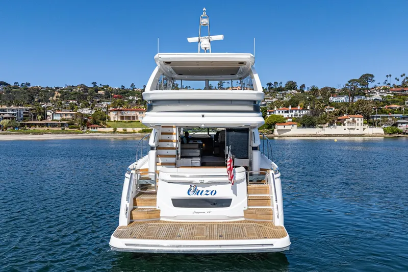 Slide: The Image of 2022 Princess F55 yacht on water, rear view with coastal background. - 25