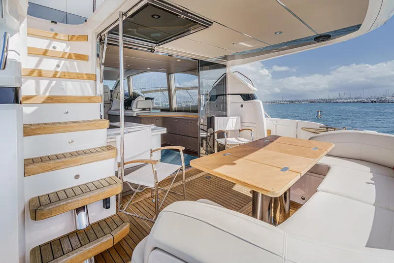 Slide: The Image of Luxurious 2022 Princess F55 yacht interior with elegant seating and wooden accents. - 28