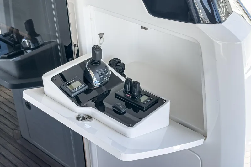 Slide: The Image of Control panel of 2022 Princess F55 yacht with modern navigation equipment. - 32