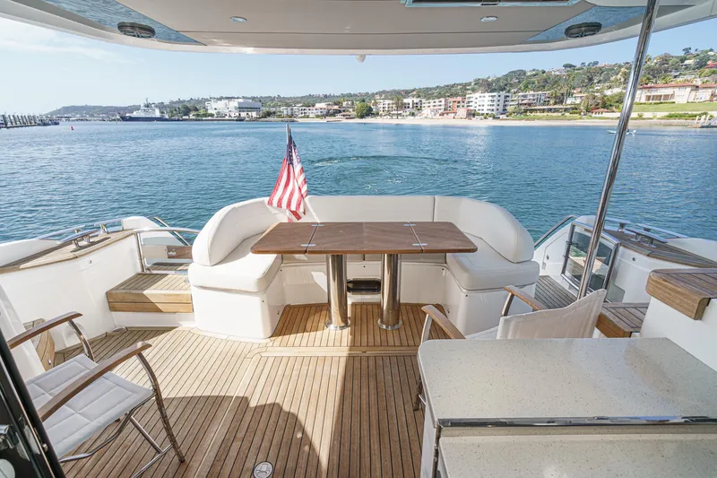 Slide: The Image of Luxurious 2022 Princess F55 yacht deck with seating, table, and ocean view. - 33