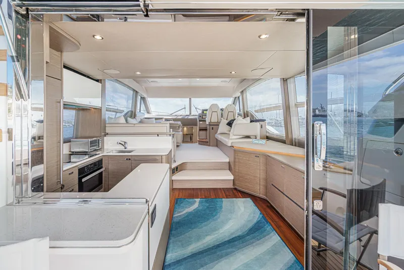 Slide: The Image of Luxurious interior of 2022 Princess F55 yacht with modern kitchen and seating area. - 36