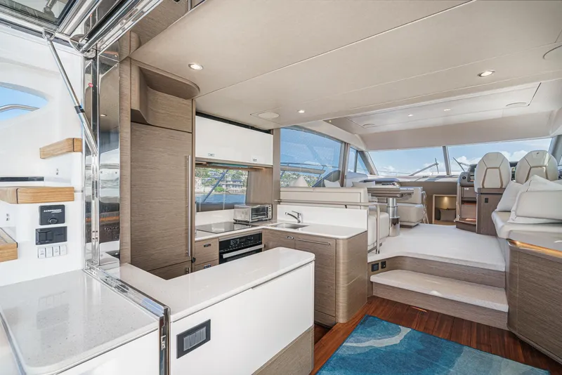 Slide: The Image of Luxurious interior of 2022 Princess F55 yacht with modern kitchen and seating area. - 37