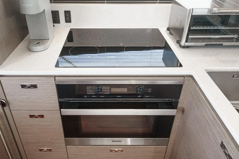 Slide: The Image of Modern kitchen in 2022 Princess F55 yacht with stovetop and oven. - 39
