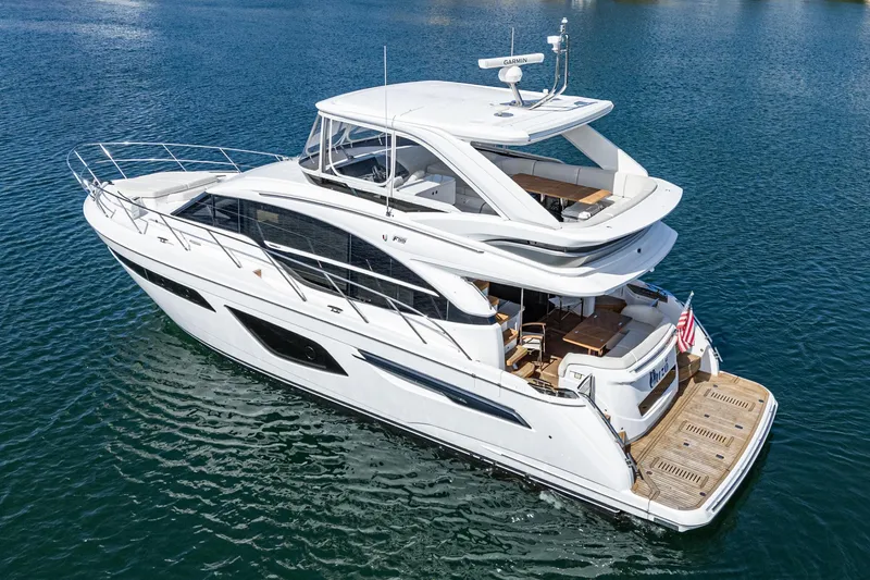 Slide: The Image of Luxury 2022 Princess F55 yacht cruising on calm blue waters. - 4