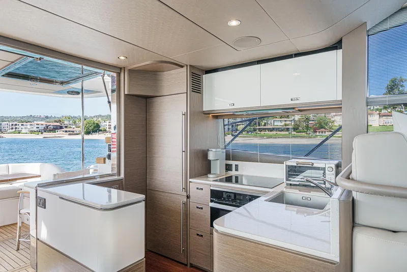 Slide: The Image of Luxurious interior of 2022 Princess F55 yacht with modern kitchen and scenic ocean view. - 40
