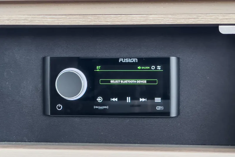 Slide: The Image of Audio control panel in a 2022 Princess F55 yacht, featuring Bluetooth connectivity options. - 44