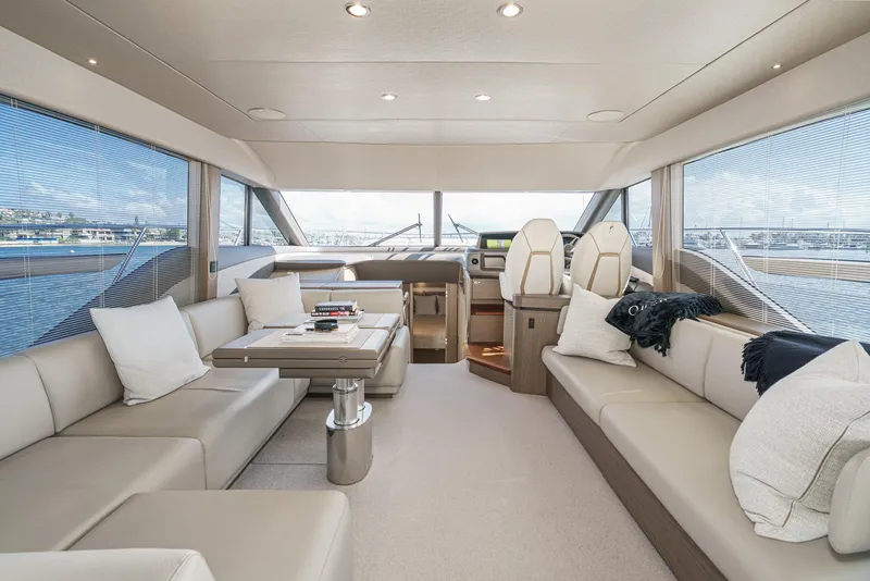 Slide: The Image of Luxurious interior of 2022 Princess F55 yacht with elegant seating and panoramic windows. - 47