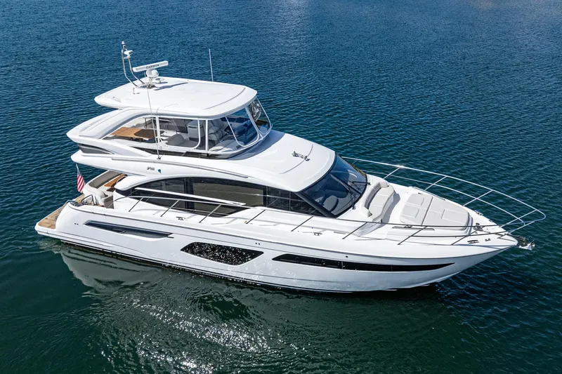 Slide: The Image of Luxurious 2022 Princess F55 yacht cruising on clear blue water. - 8