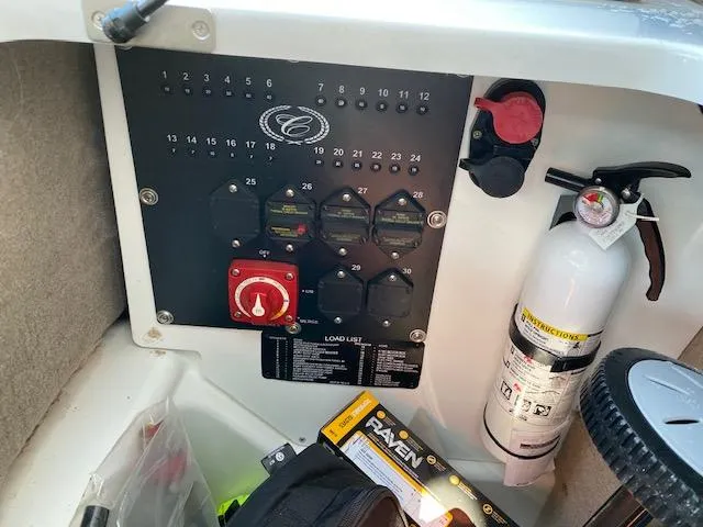 Slide: The Image of Control panel of a 2021 Cobalt R8 boat with fire extinguisher and accessories. - 15
