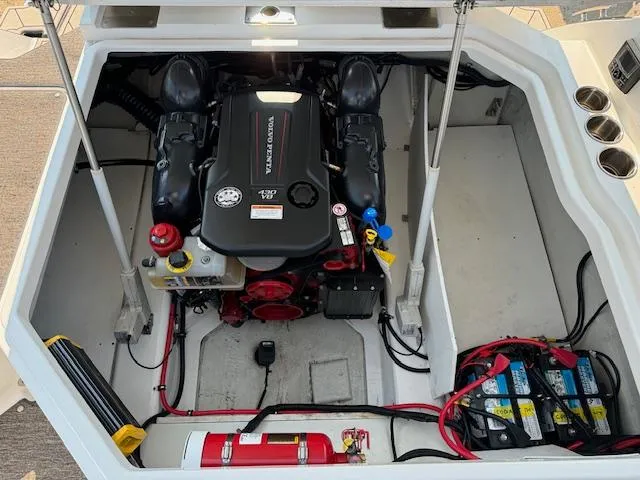 Slide: The Image of Engine compartment of a 2021 Cobalt R8 boat, featuring a neatly organized layout. - 7