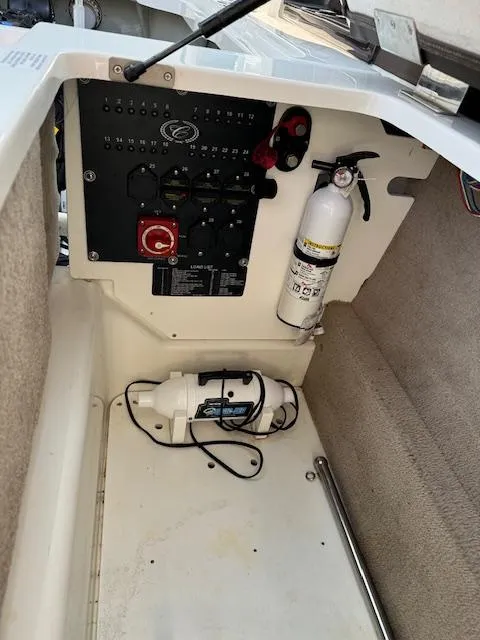 Slide: The Image of Control panel and fire extinguisher in 2021 Cobalt R8 boat interior. - 8