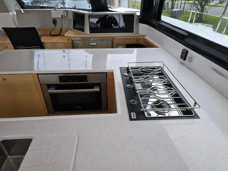Slide: The Image of Modern kitchen in 2025 Seawind 1370 yacht with stove and oven. - 14